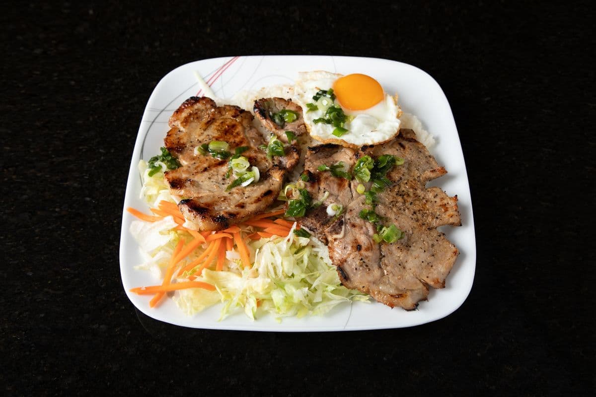 54. Charbroiled Pork Chop and Pan-Fried Egg on Rice - Com Suon Trung Chien