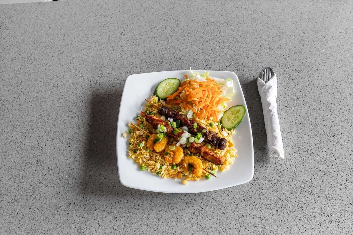 R65. Satay Chicken, Beef, and Shrimp Skewers on Fried Rice