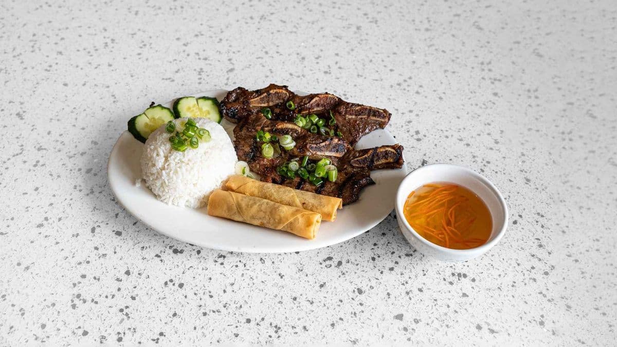 66. Charbroiled Beef Back Ribs & Springs Rolls On Steamed Rice