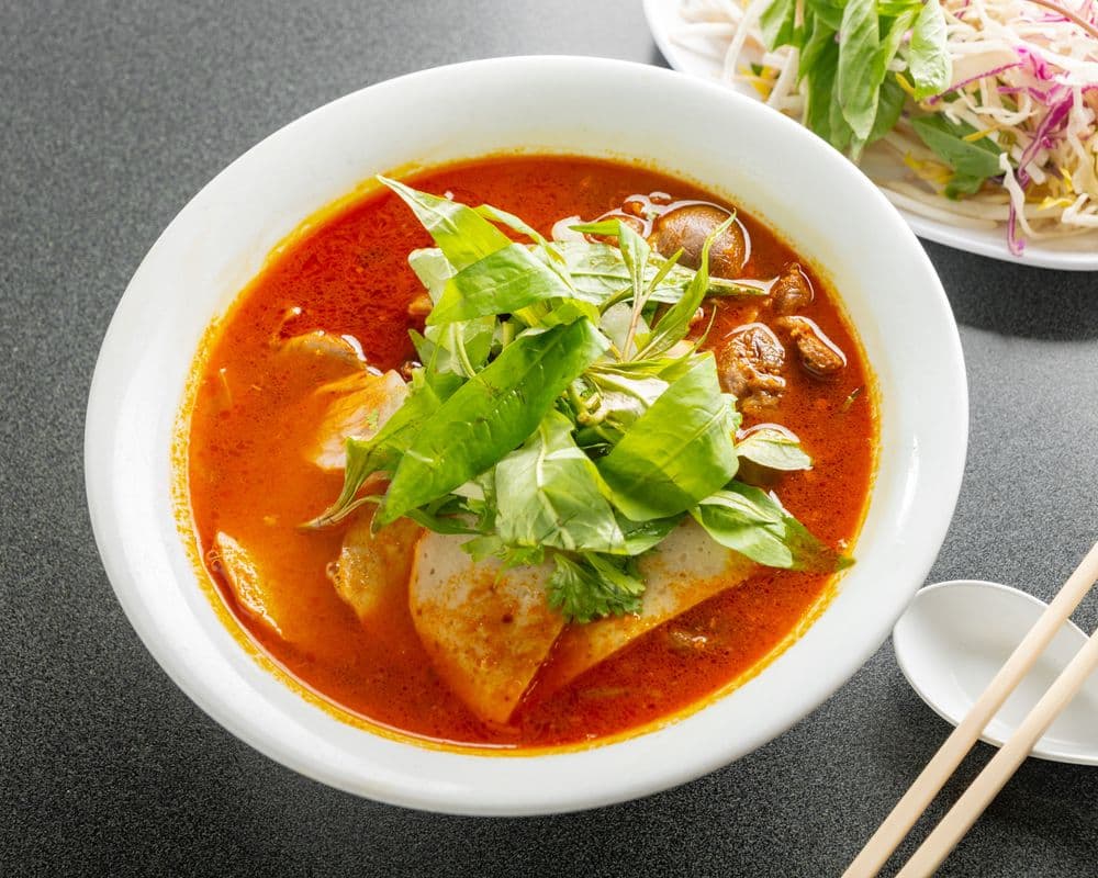 304. Hue Style Beef and Pork with Blood Pudding and Vermicelli in Spicy Soup