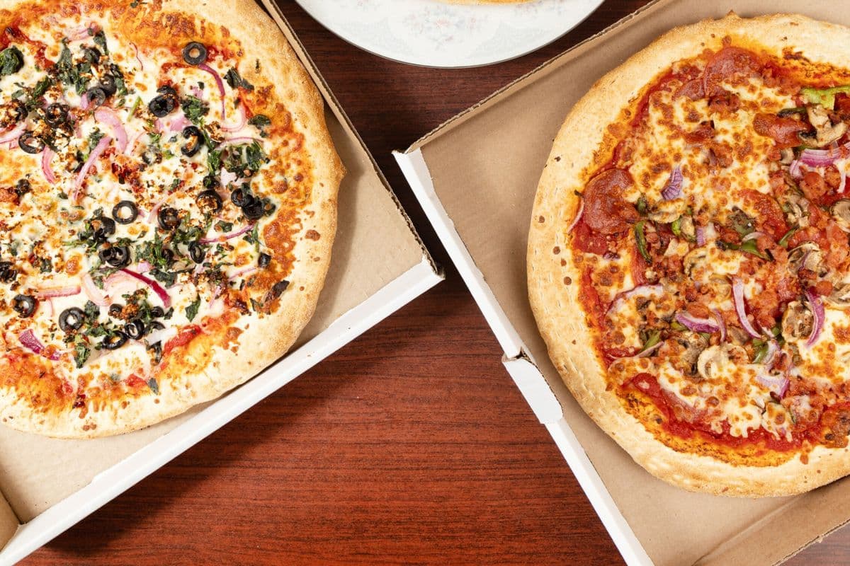 Family Deal Two - Two Medium Pizzas with Three Toppings Each, Ten Wings, Four Pops, Two Dips, and Wedges