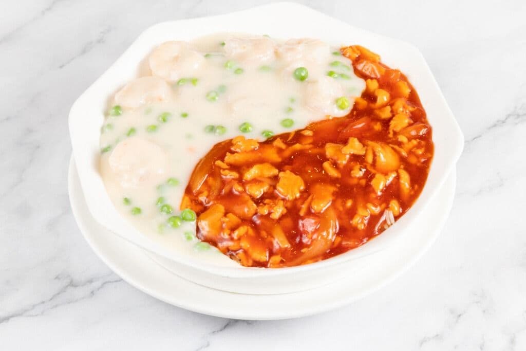 Shrimp and Chicken with Cream and Tomato Sauce on Fried Rice