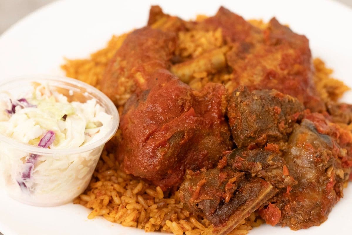 Jollof rice, 3 peppered turkey, 4pcs of peppered beef and coleslaw