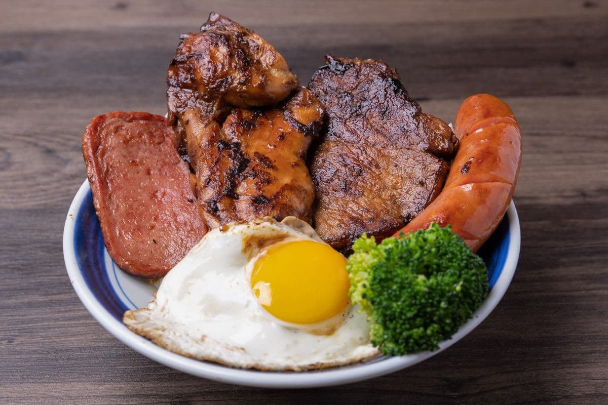 A01. Pork Chop, Chicken Cutlet, Sausage, and Sunny Side-Up Egg (行運冰室公司飯)