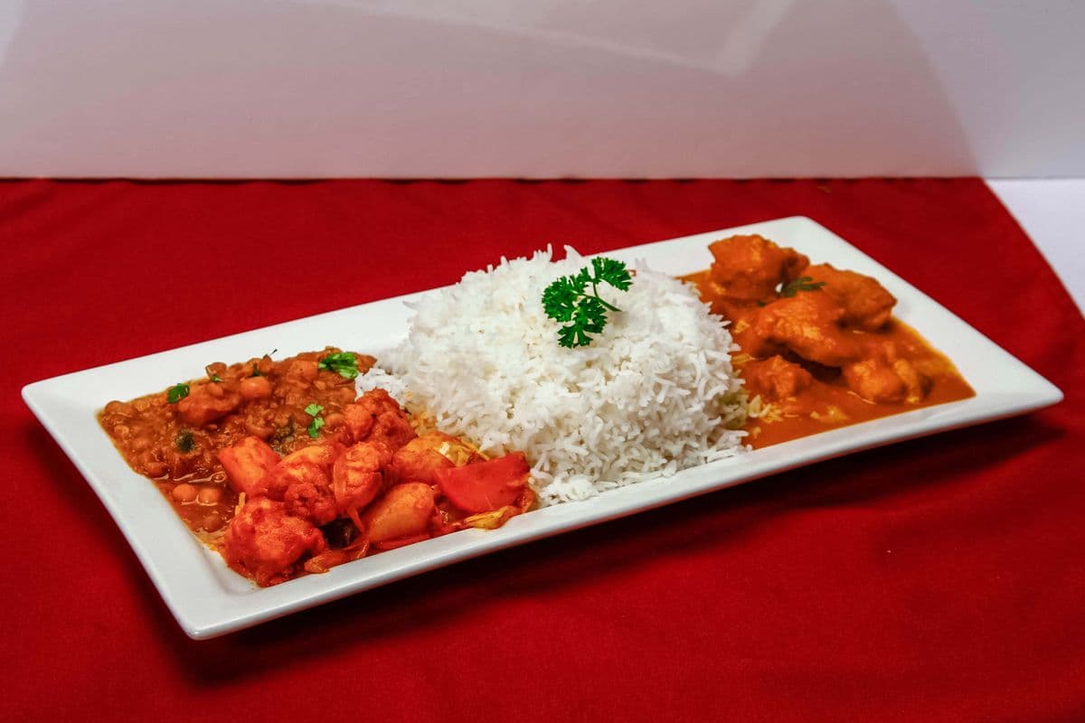 Butter Chicken, Rice, Pea Curry, and Vegetables