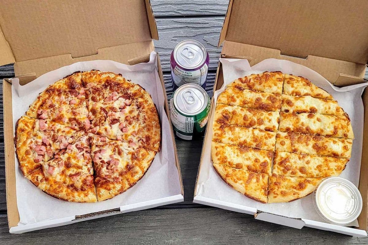 Medium Two Topping Pizza, Medium Garlic Cheese Sticks, and Two Cans of Pops
