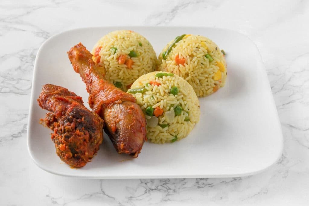 Fried Rice and Two Pieces of Peppered Chicken