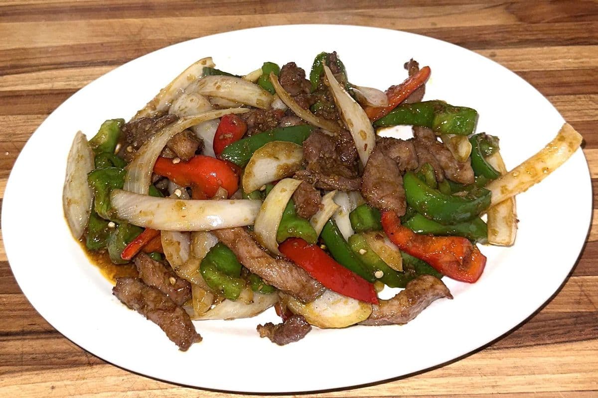 71. Pan Fried Lemongrass Pork Chop, Green Pepper and Onions
