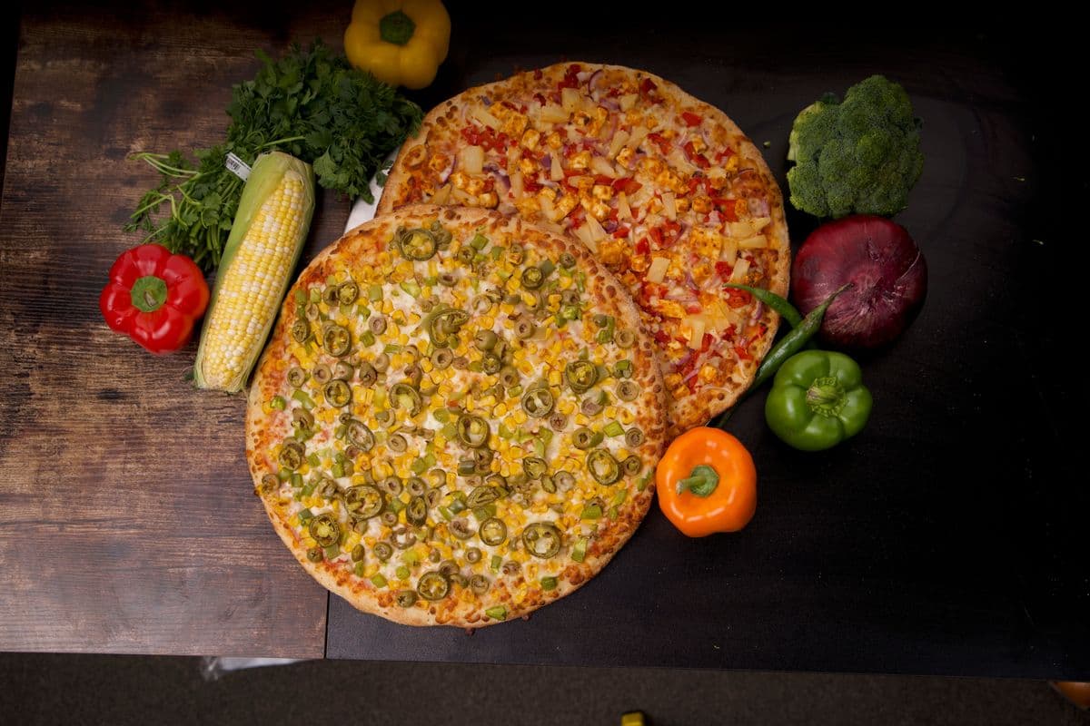 Mr. Singh's Doubles (2 Medium Pizza's, 3 Toppings Each, 2 Dips, 2 Pops)