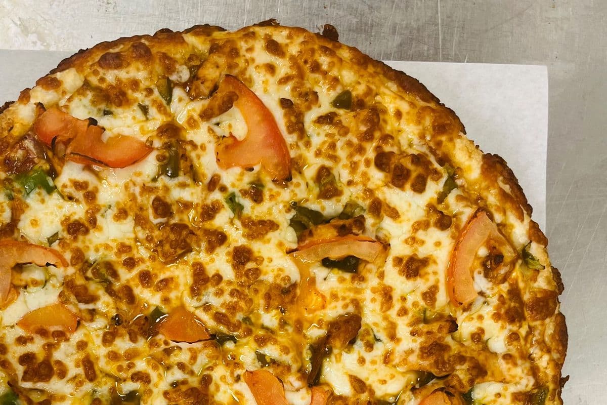 12" Medium Signature Butter Chicken Pizza and Choice of Second Pizza