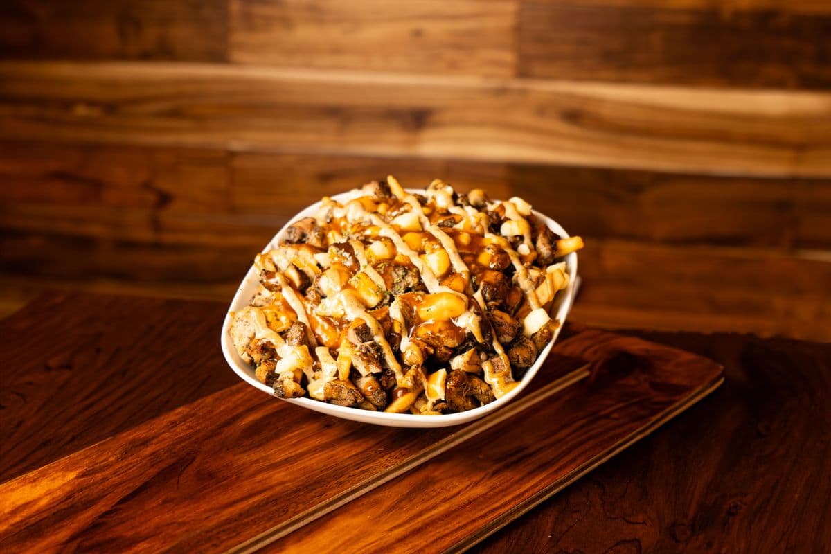 The Original Jerk Chicken Poutine (Top Seller)