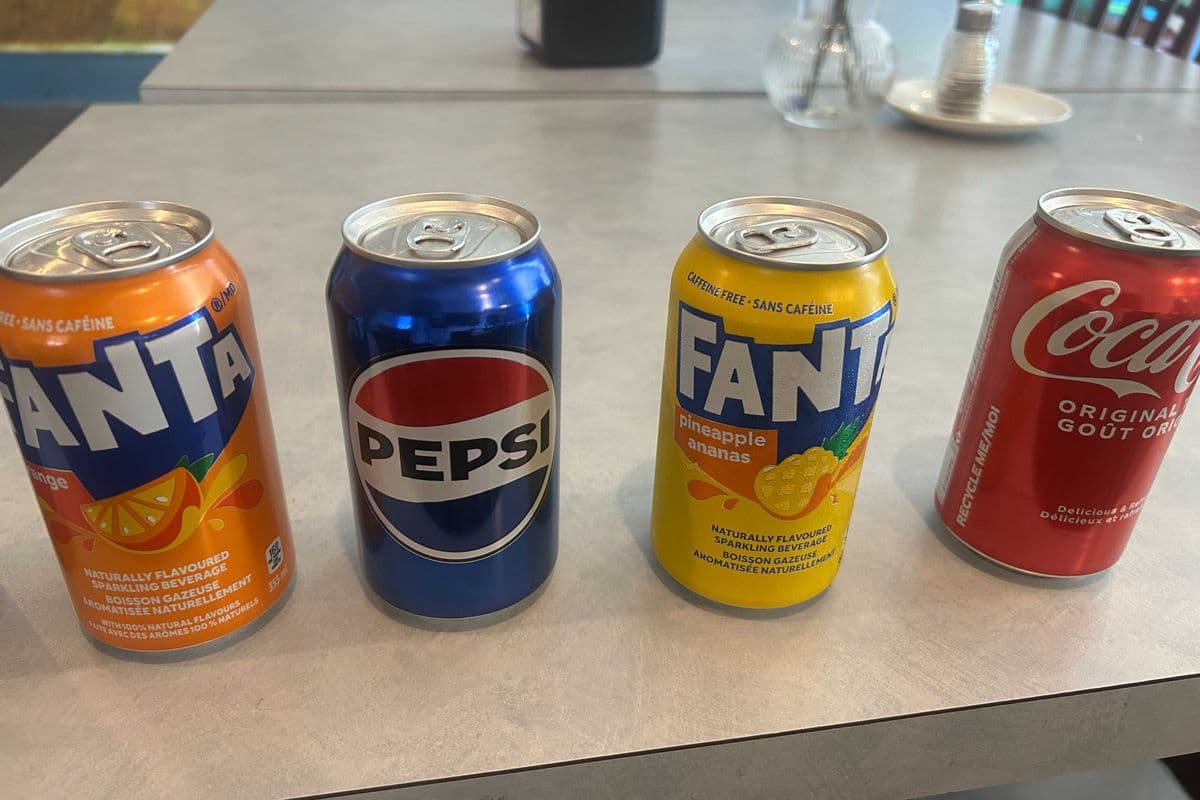 EITHER CAN FANTA , PEPSI, COKE , PINEAPPLE SODA