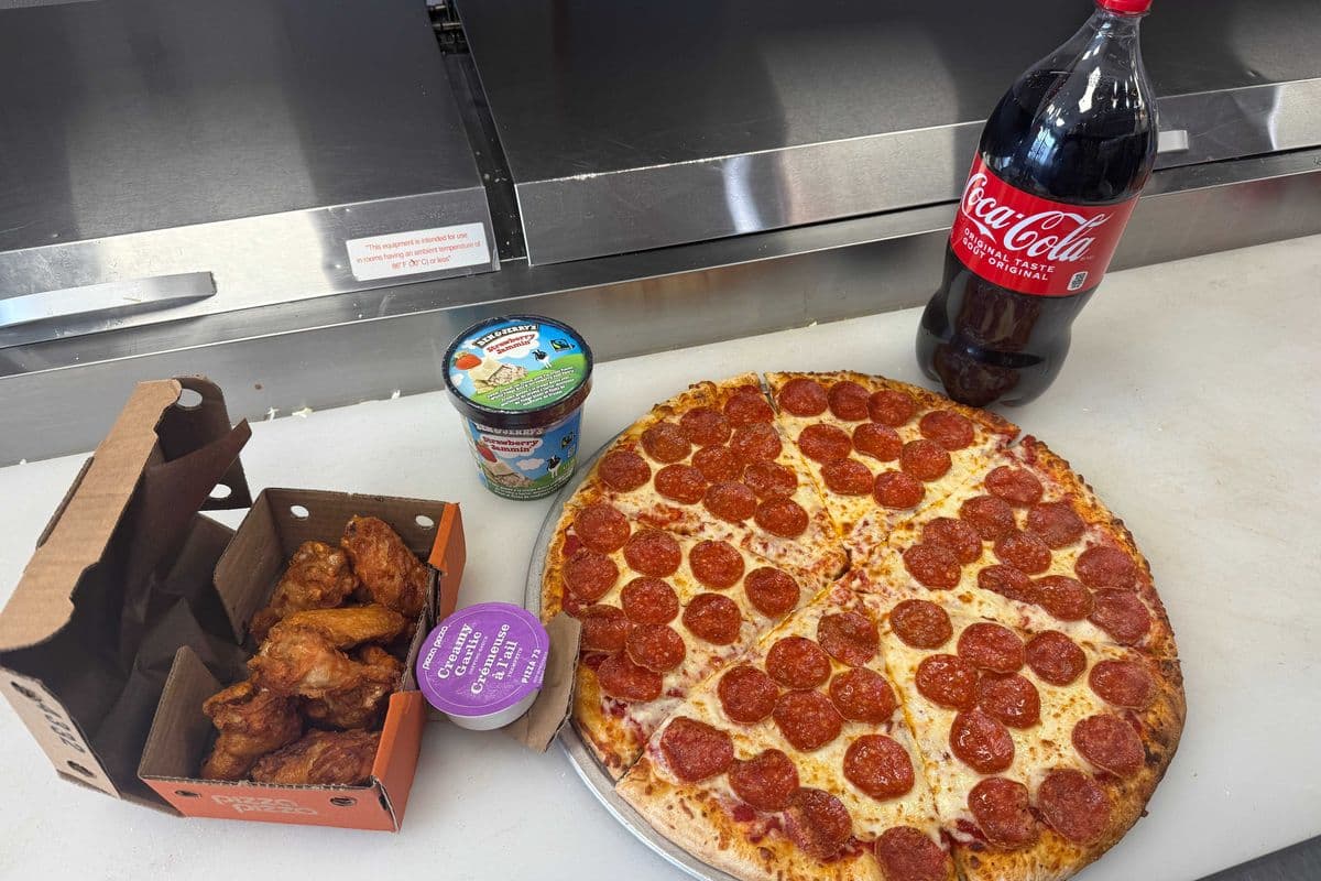Large single topping pizza, 2L coke, 10 Chicken wings, Ben and jerry's ice cream
