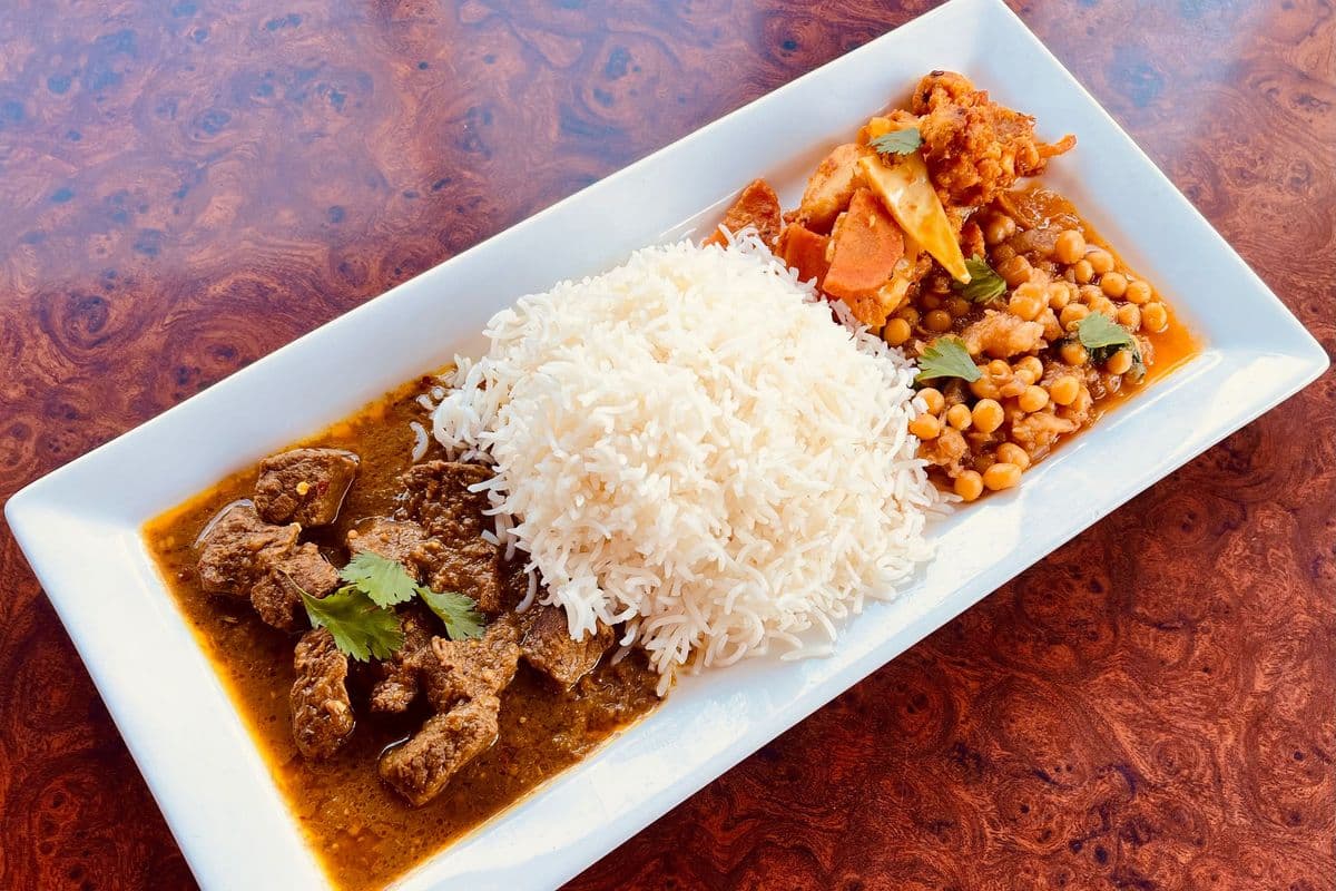 Beef Curry, Rice, Pea Curry, and Vegetables
