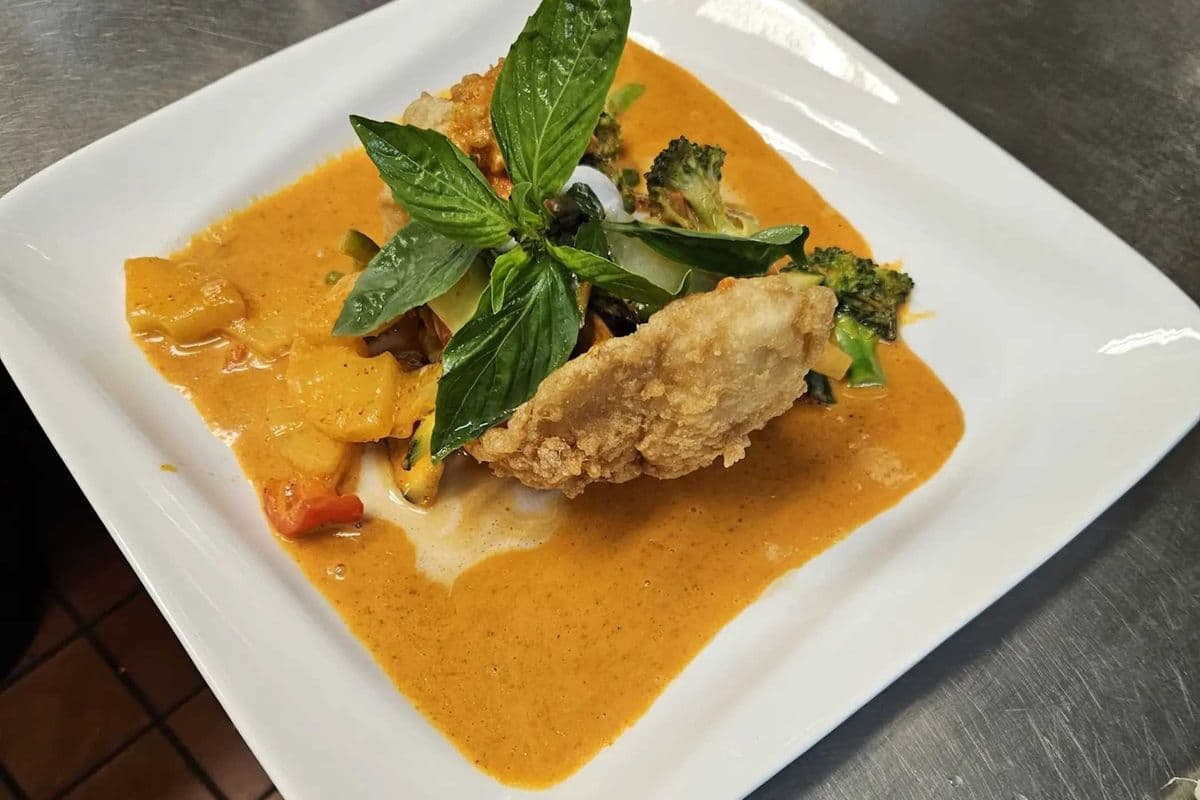 16. Crispy Sea Bass with Panaeng Curry, Pineapple, Vegetables and a bowl of jasmine steam rice. (medium spicy) ** New