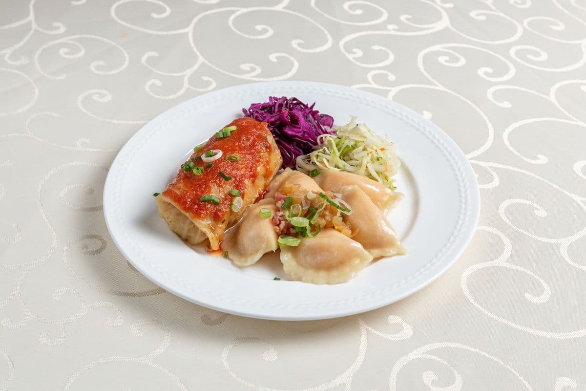 Pierogi with a Meat and Rice Cabbage Roll in Red Sauce & Slaw