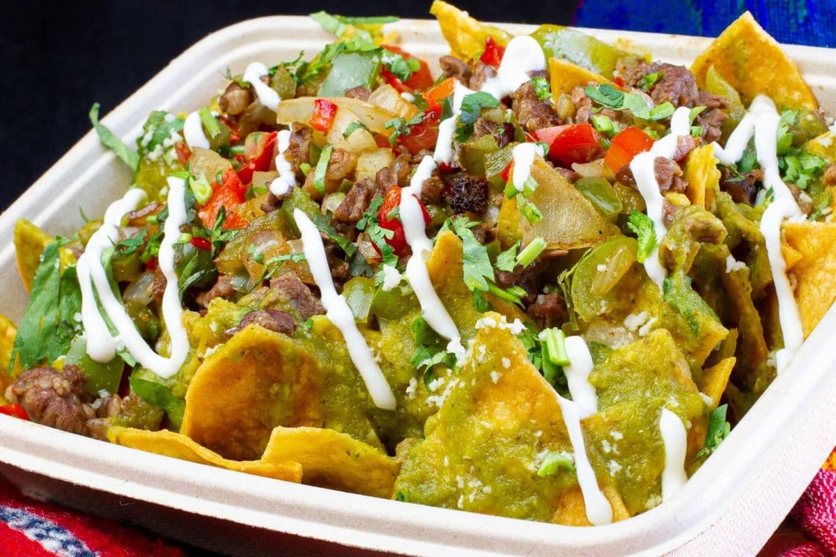 The Chilaquiles eh! - Campechano (spicy pork chorizo, tender beef, and bacon)