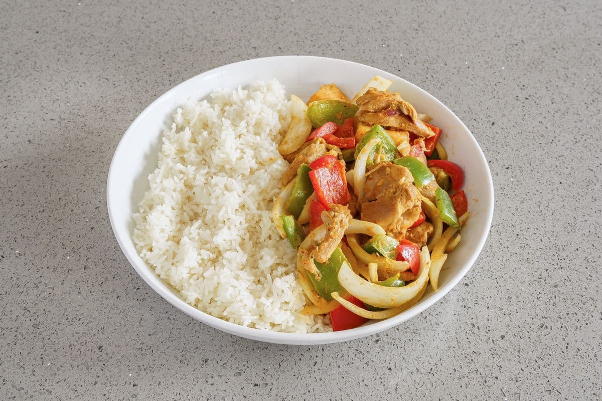 R64. Curry Chicken (Dark Meat) on Steamed Rice (Contains Dairy)