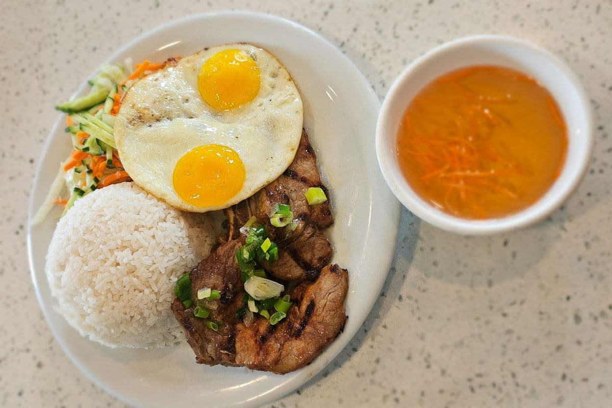 57. Grilled Pork Chop (1 pc) with Eggs (2 pcs) on Rice
