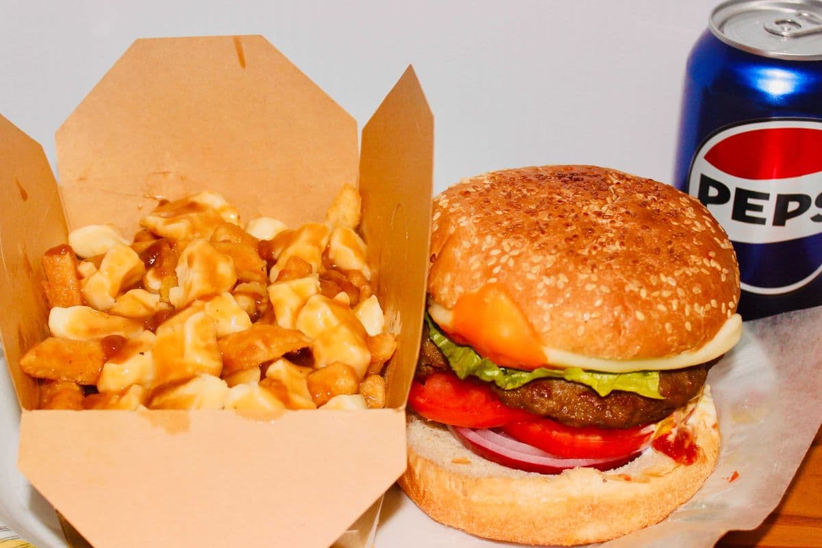 Cheeseburger, Poutine, and a can of pop