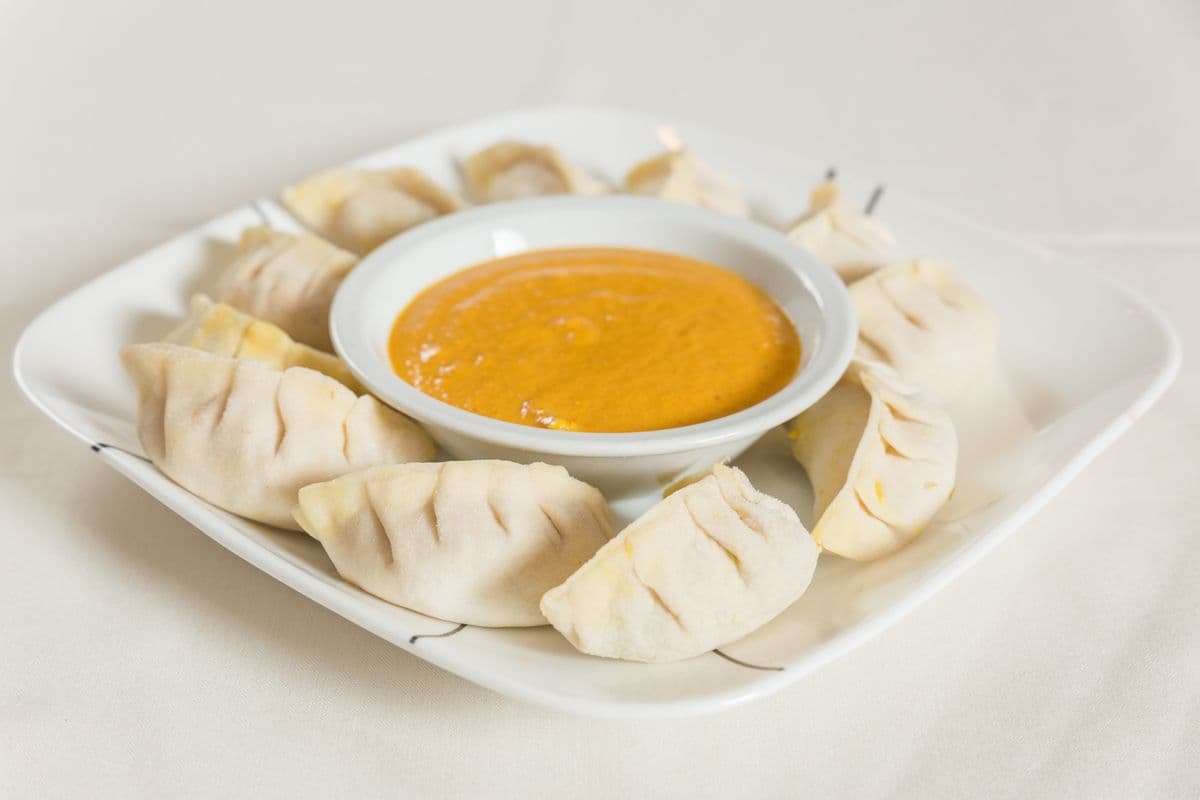 Chicken Steamed Momo 10 pcs (Vegetable Steamed Momo (10pcs) Provided Tomato chutney and hot sauce on side