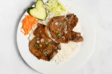 49. Charbroiled Pork Chops on Steamed Rice (2 pcs)