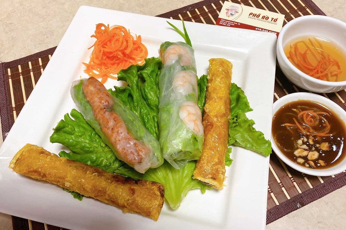 A6. A combination dish of fried pork spring roll, fried vegetable spring roll, and salad roll with shrimp and grilled marinated minced pork roll.