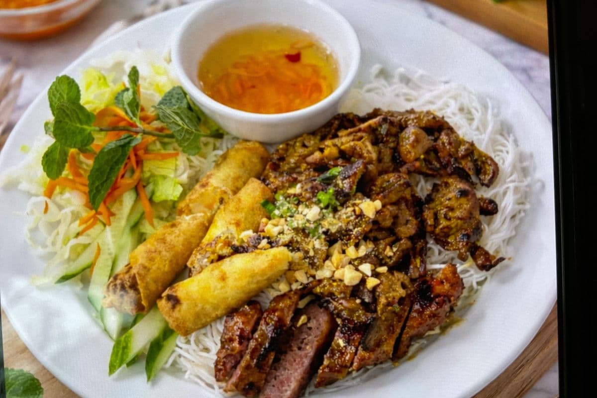 Grilled Chicken, Beef, and Spring Rolls on Vermicelli