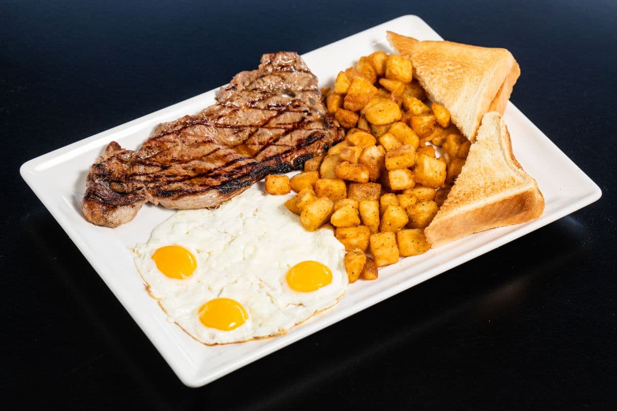 13. New York Steak, Eggs, Toast, and Home Fries