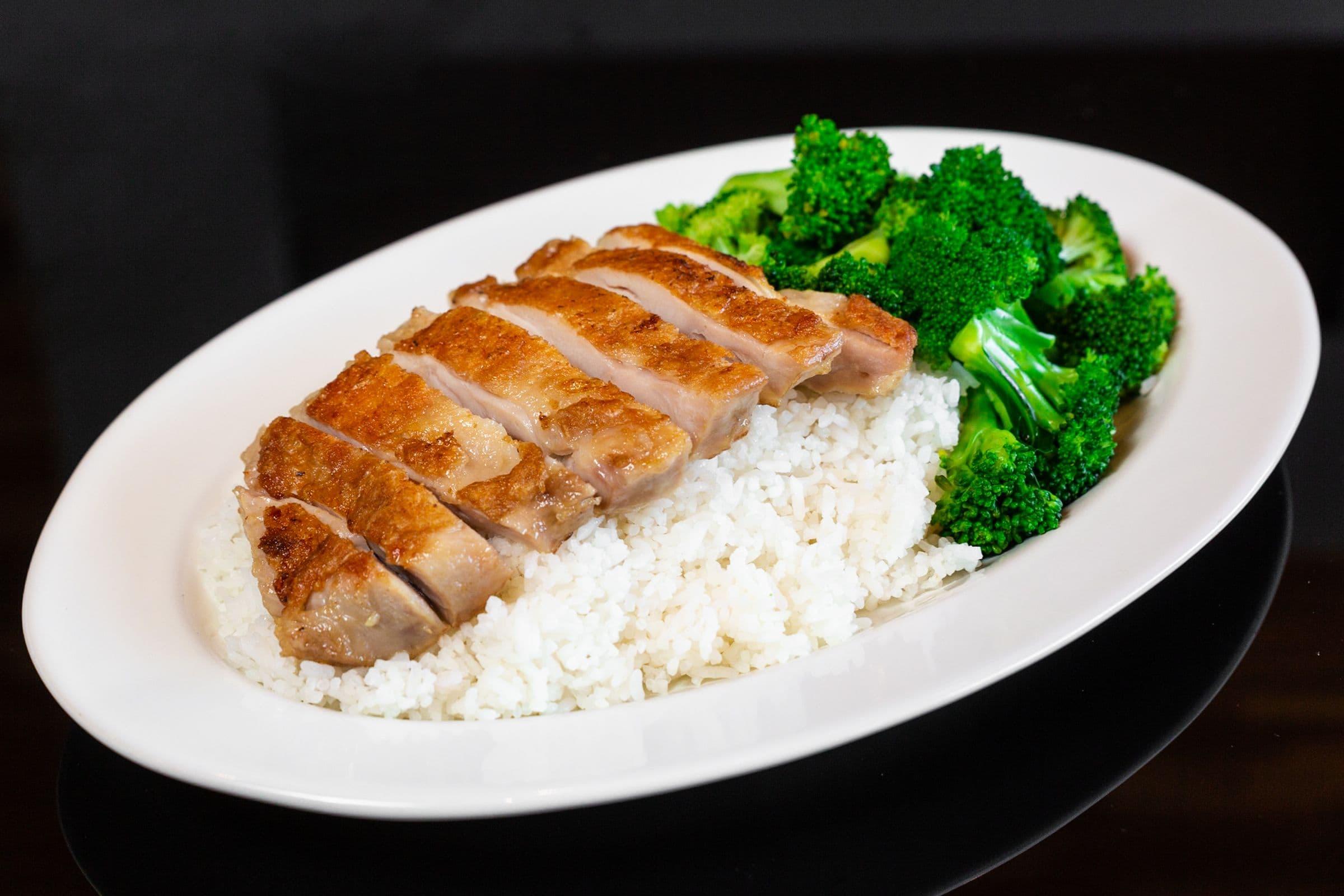 124. Chicken Steak with Broccoli on Steamed Rice