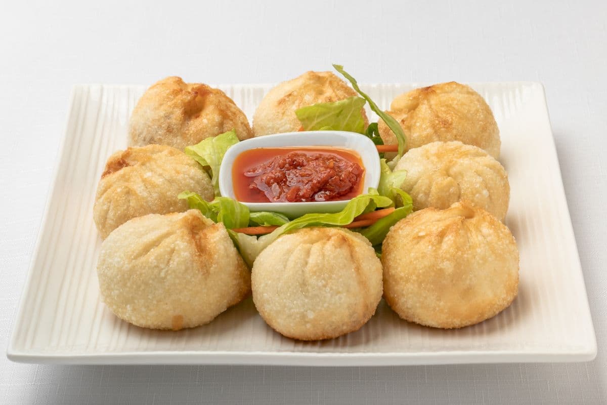 18. Beef Momos (8 pcs)