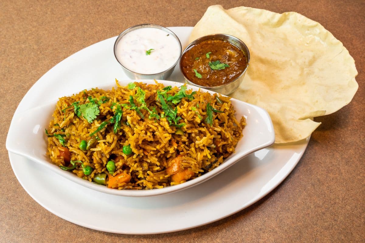 91. Vegetable Biryani with Raita and Gravy