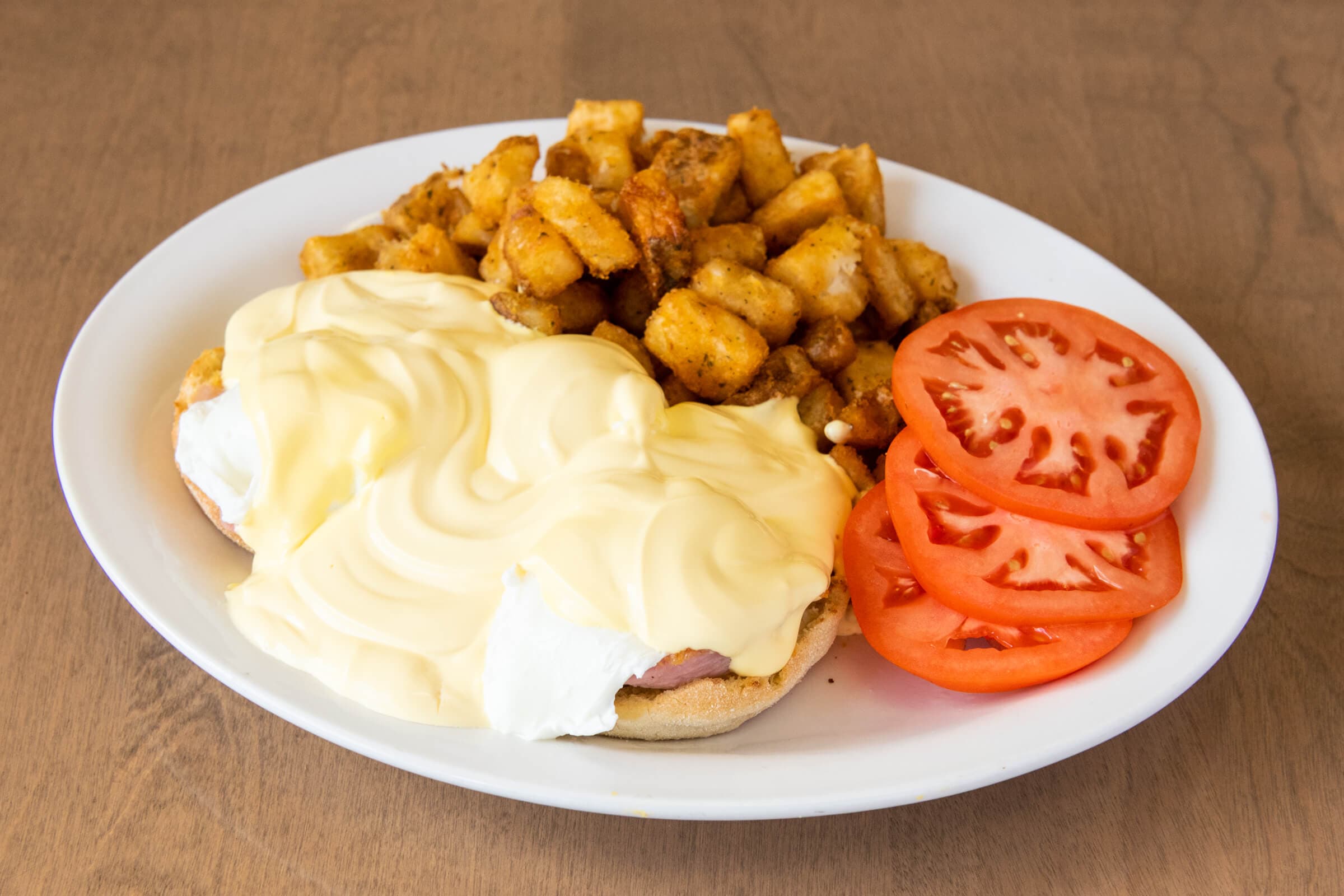 Eggs Benedict with Choice of Protein and Side