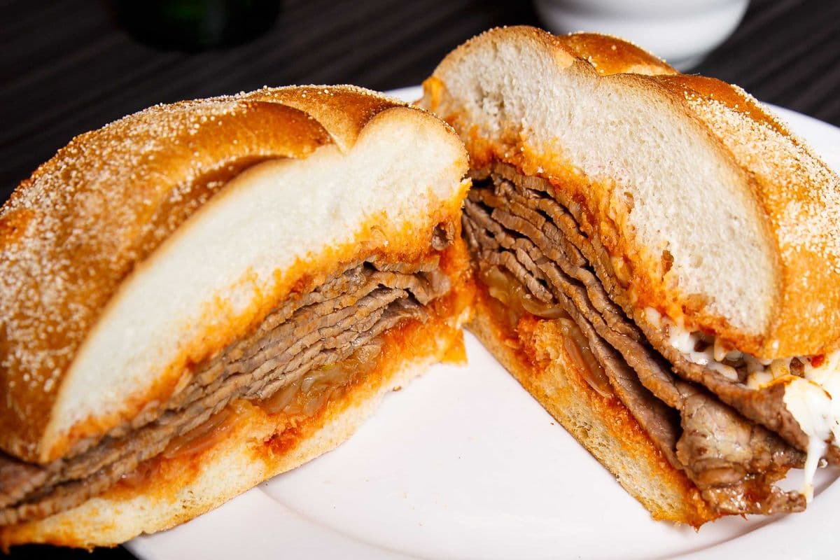 Steak Sandwich with Tomato Sauce and Sauteed Onions